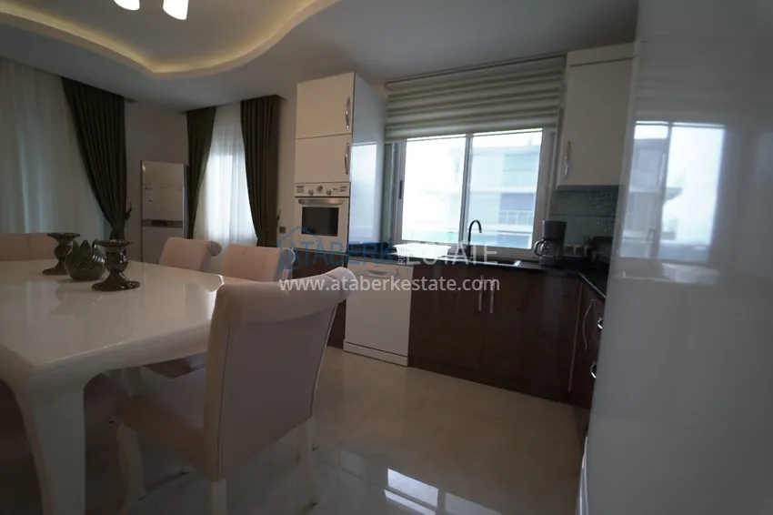 Приобрести Дуплекс в Махмутларе с мебелью и застекленным балконом в благоустроенной резиденции 11 