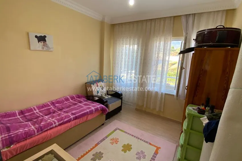 Приобрести Квартира в Махмутларе с мебелью и видом на горы с хорошо продуманной планировкой в комплексе городского типа 18 