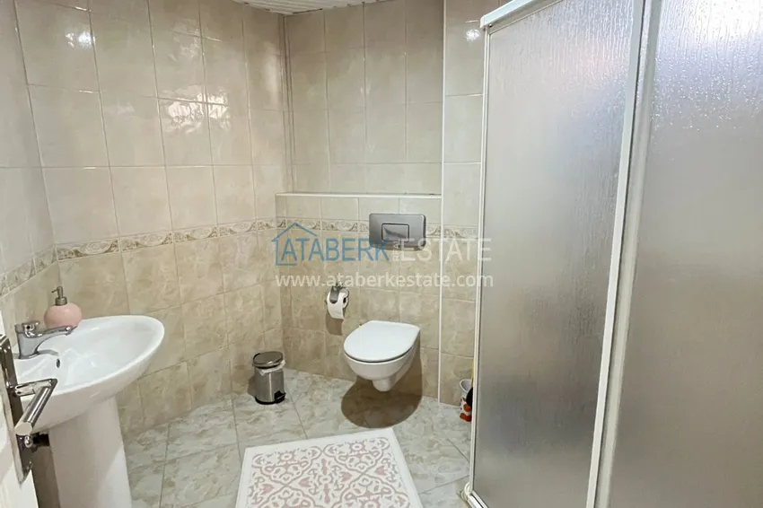 Приобрести Квартира в центре Алании, трехкомнатная с мебелью и отдельной кухней 13 