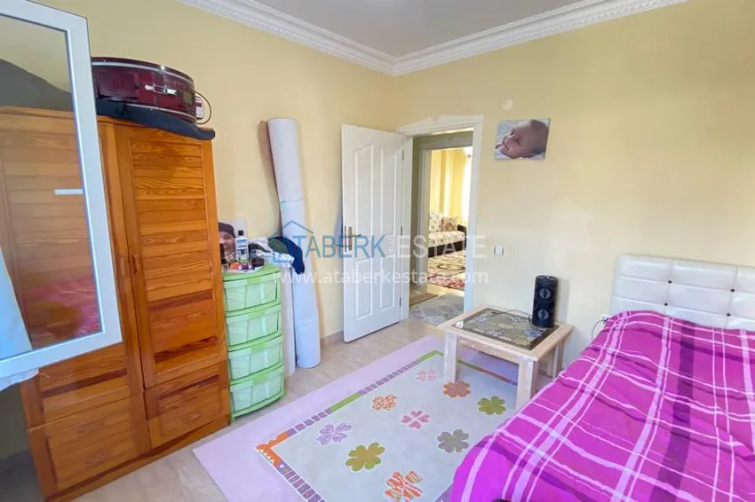 Приобрести Квартира в Махмутларе с мебелью и видом на горы с хорошо продуманной планировкой в комплексе городского типа 19 