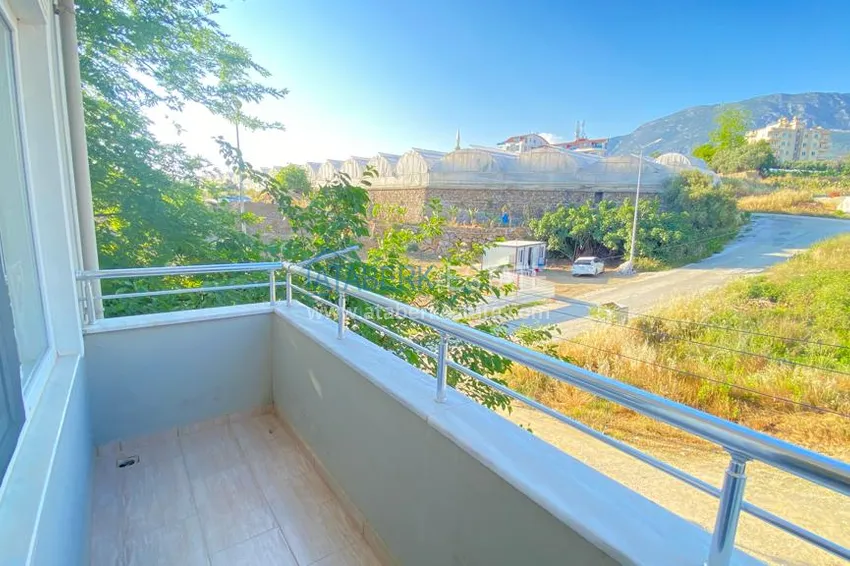 Приобрести Квартира в Махмутларе с мебелью и видом на горы с хорошо продуманной планировкой в комплексе городского типа 20 