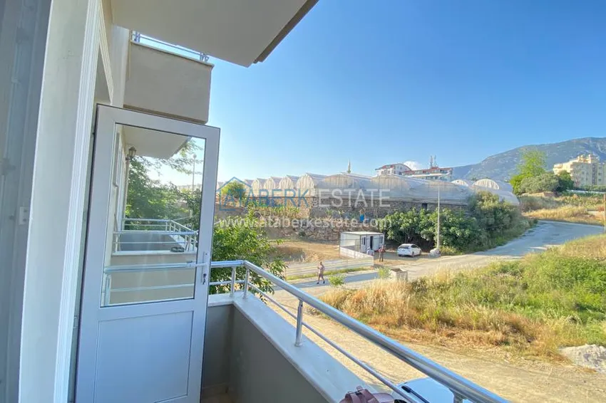 Приобрести Квартира в Махмутларе с мебелью и видом на горы с хорошо продуманной планировкой в комплексе городского типа 21 