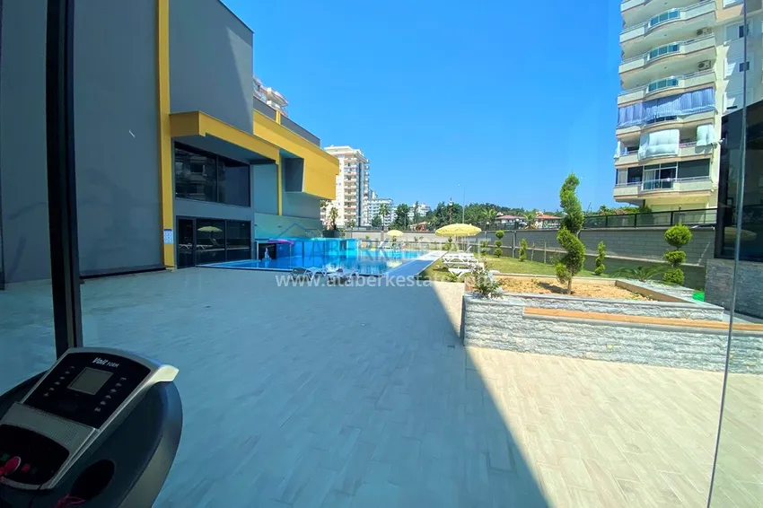 Квартира Махмутларе меблированная с отдельной кухней и частичным видом на море 18 