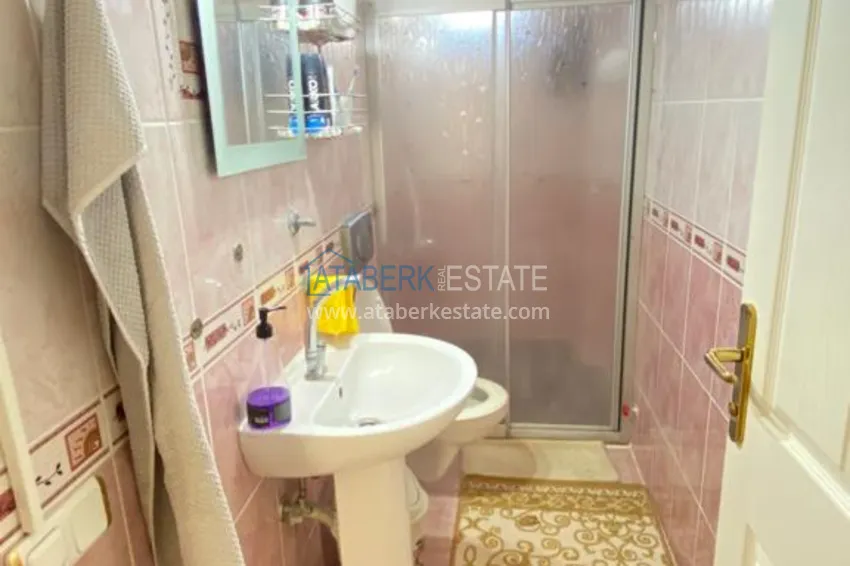 Приобрести Квартира в Махмутларе с мебелью и видом на горы с хорошо продуманной планировкой в комплексе городского типа 22 