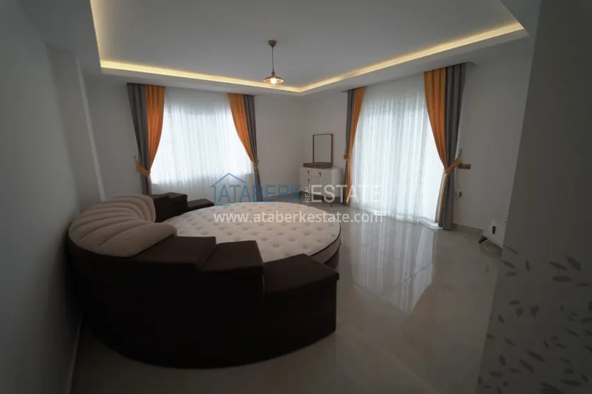 Приобрести Дуплекс в Махмутларе с мебелью и застекленным балконом в благоустроенной резиденции 15 