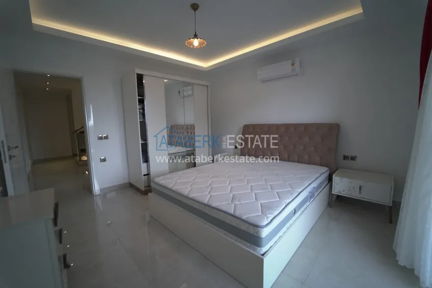 Приобрести Дуплекс в Махмутларе с мебелью и застекленным балконом в благоустроенной резиденции 16 