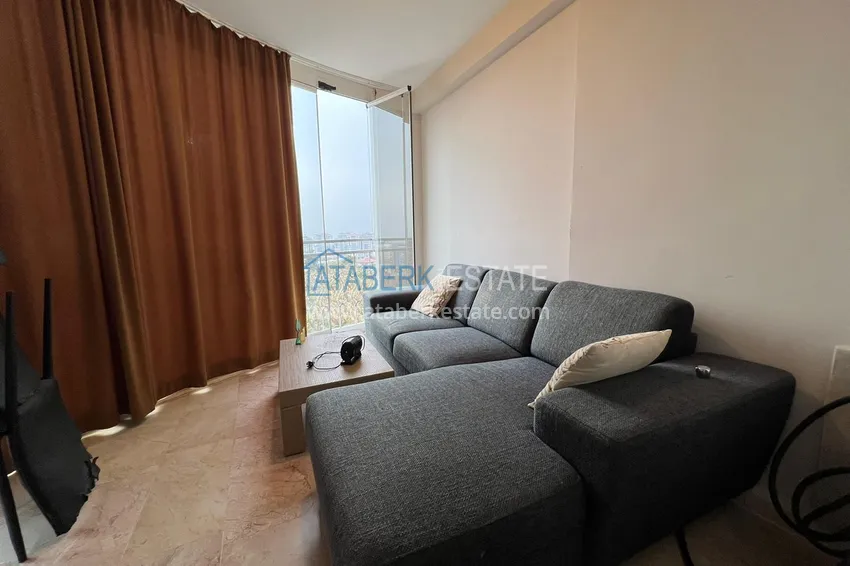 Приобрести Квартира в Махмутларе с мебелью, видом на горы в жилом комплексе 17 