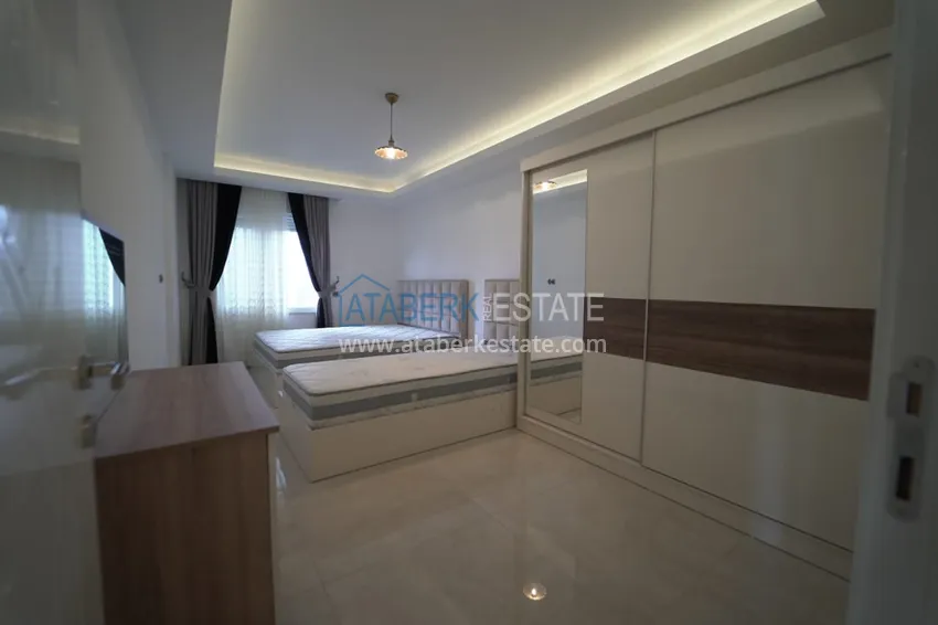 Приобрести Дуплекс в Махмутларе с мебелью и застекленным балконом в благоустроенной резиденции 18 