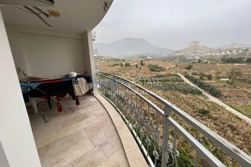 Приобрести Квартира в Махмутларе с мебелью, видом на горы в жилом комплексе 19 