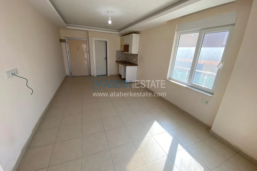 Приобрести Квартира-студия в Махмутларе в уютном комплексе рядом с морем 1 