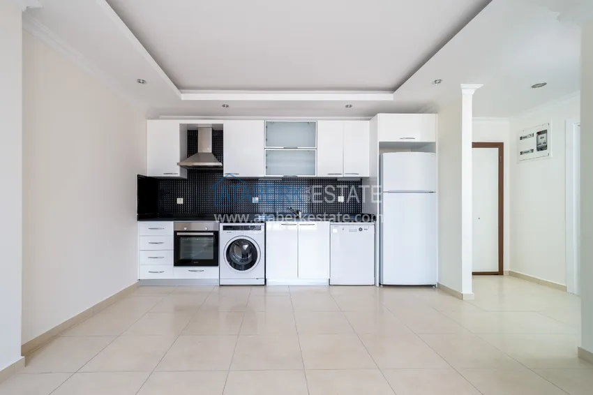 Приобрести Квартира двухкомнатная с видом на море в комплексе с частным пляжем в Авсалларе 1 