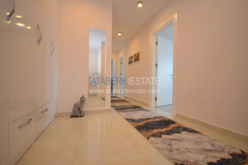 Приобрести Квартира Махмутларе меблированная с отдельной кухней и частичным видом на море 1 