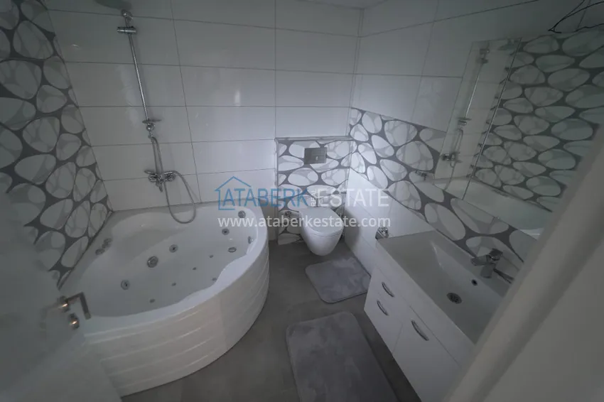 Приобрести Дуплекс в Махмутларе с мебелью и застекленным балконом в благоустроенной резиденции 24 