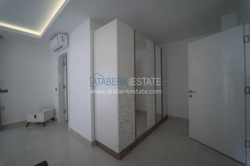 Приобрести Дуплекс в Махмутларе с мебелью и застекленным балконом в благоустроенной резиденции 25 