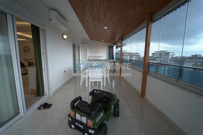 Приобрести Дуплекс в Махмутларе с мебелью и застекленным балконом в благоустроенной резиденции 26 