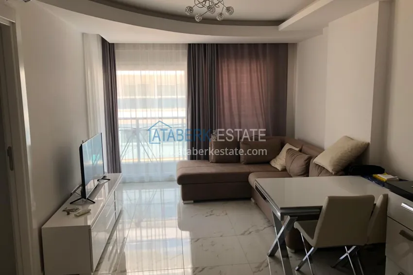 Приобрести Квартира в Авсалларе с мебелью в элитном комплексе у пляжа Инджекум 2 