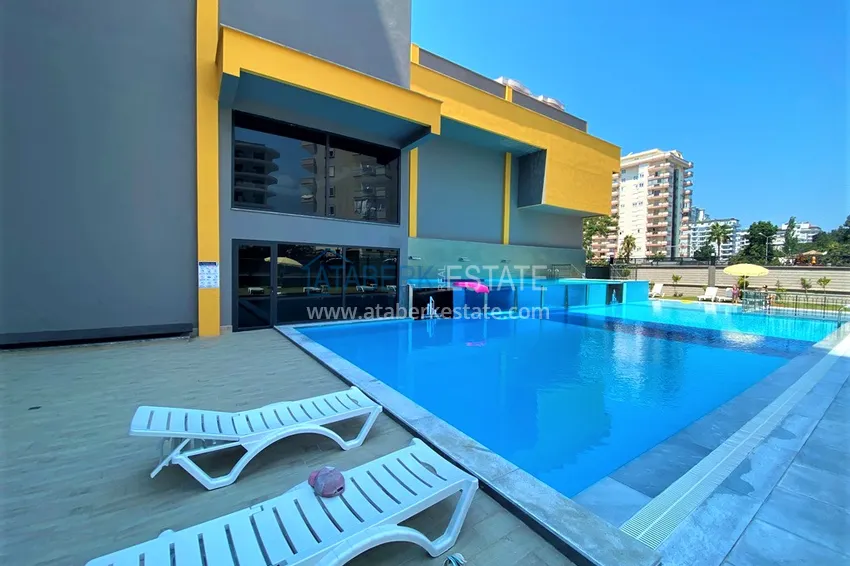 Квартира Махмутларе меблированная с отдельной кухней и частичным видом на море 1 