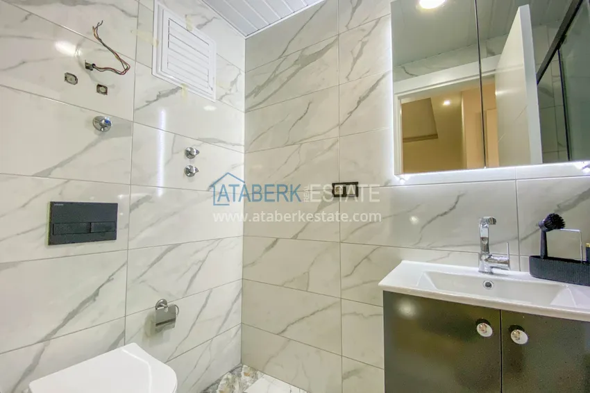 Приобрести Садовый дуплекс в Алании – район Оба с чистовой отделкой и новой мебелью 39 