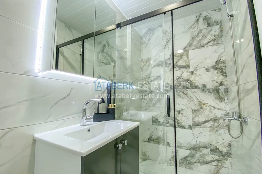 Приобрести Садовый дуплекс в Алании – район Оба с чистовой отделкой и новой мебелью 40 