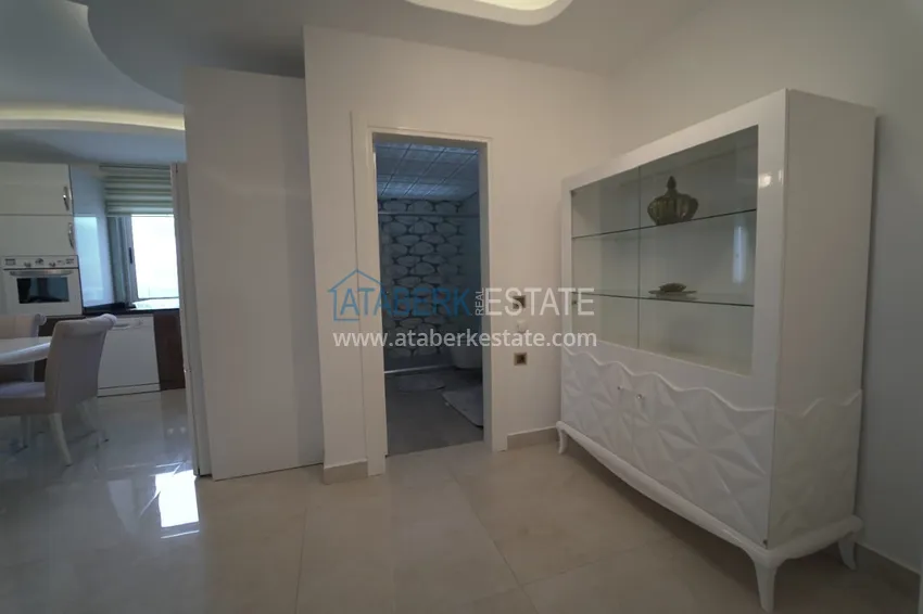 Приобрести Дуплекс в Махмутларе с мебелью и застекленным балконом в благоустроенной резиденции 3 