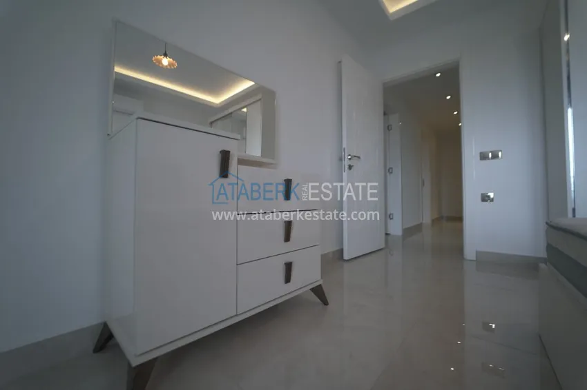 Приобрести Дуплекс в Махмутларе с мебелью и застекленным балконом в благоустроенной резиденции 4 