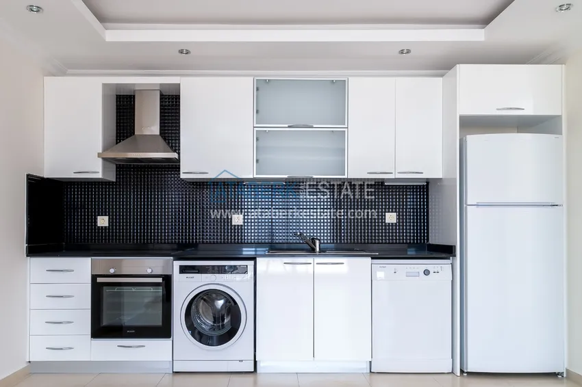 Приобрести Квартира двухкомнатная с видом на море в комплексе с частным пляжем в Авсалларе 4 