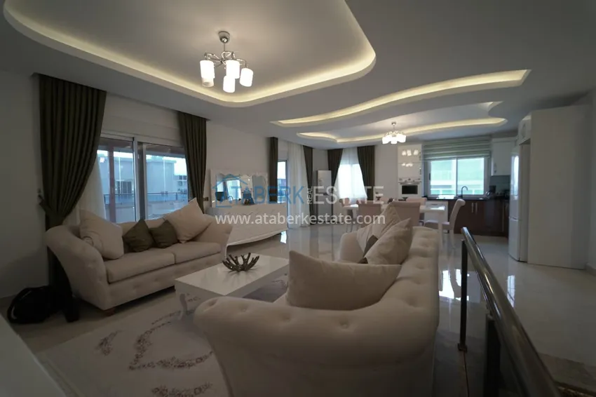 Приобрести Дуплекс в Махмутларе с мебелью и застекленным балконом в благоустроенной резиденции 5 