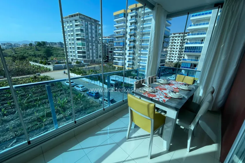 Приобрести Квартира с мебелью и застекленным балконом в Махмутларе 5 