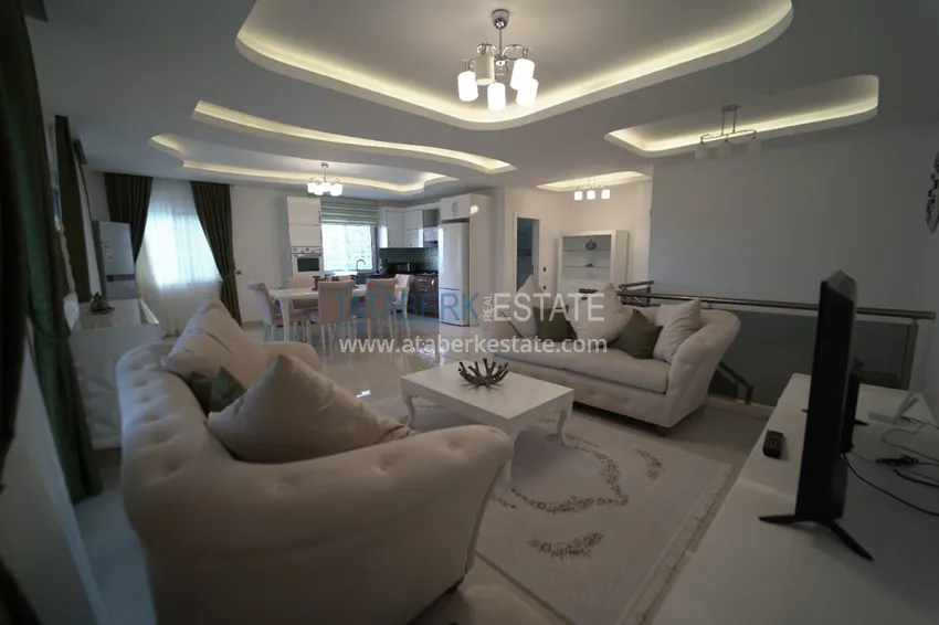 Приобрести Дуплекс в Махмутларе с мебелью и застекленным балконом в благоустроенной резиденции 6 