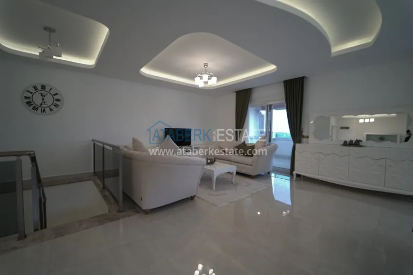 Приобрести Дуплекс в Махмутларе с мебелью и застекленным балконом в благоустроенной резиденции 8 