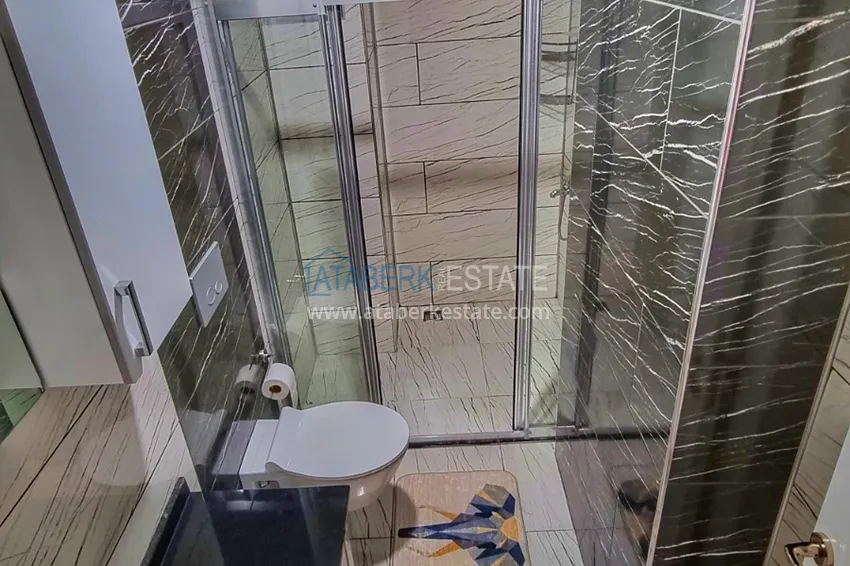 Приобрести Квартира в Махмутларе со стильным интерьером, отдельной кухней и видом на море 12 