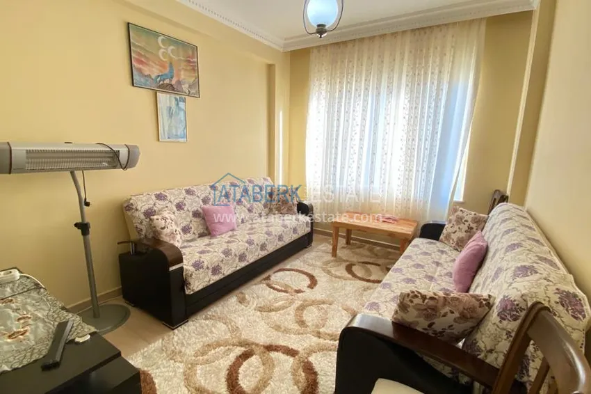 Приобрести Квартира в Махмутларе с мебелью и видом на горы с хорошо продуманной планировкой в комплексе городского типа 16 