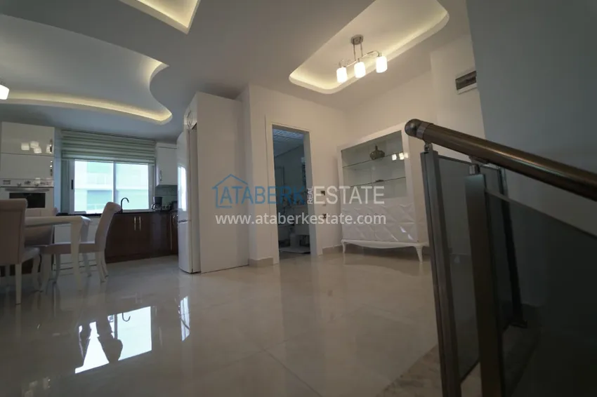 Приобрести Дуплекс в Махмутларе с мебелью и застекленным балконом в благоустроенной резиденции 9 