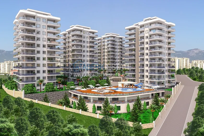 Квартиры в Алании - район Махмутлар в строящемся жилом комплексе 1