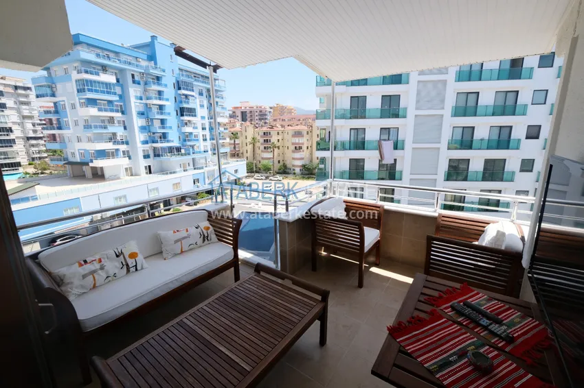 Приобрести Квартира в Махмутларе трехкомнатная с мебелью на 1 береговой линии 10 