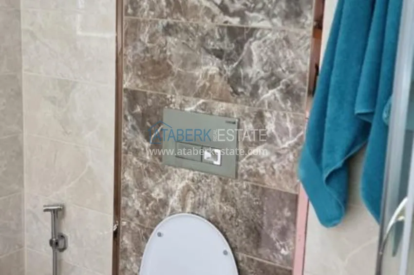 Приобрести Квартира в Махмутларе в благоустроенном жилом комплексе полностью готовая для проживанияи с мебелью с видом на море и горы 10 