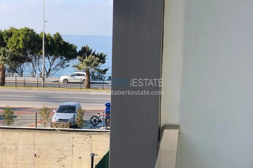 Приобрести Дуплекс в Махмутларе с боковым видом на море на первой береговой линии 10 