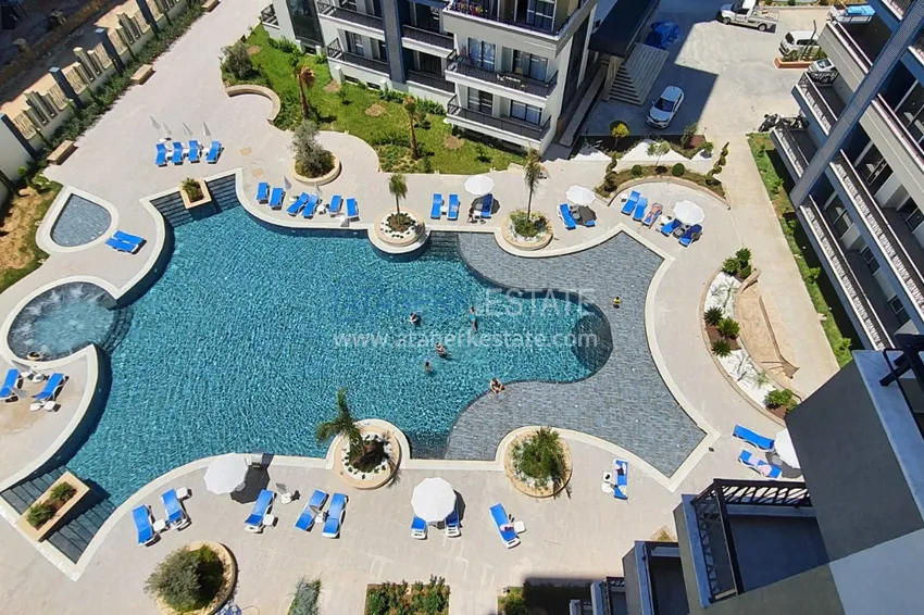 Приобрести Квартира в Махмутларе с мебелью и видом на море в резиденции отельного типа 10