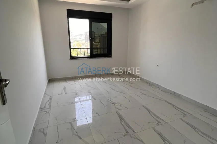 Приобрести Квартира в Махмутларе с видом на горы в современном жилом комплексе 9 