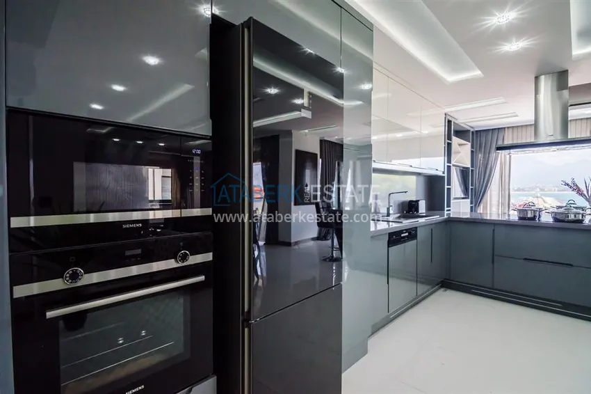 Приобрести Стильная квартира в историческом центре Алании, с дизайнерским интерьером и видом на порт 14 