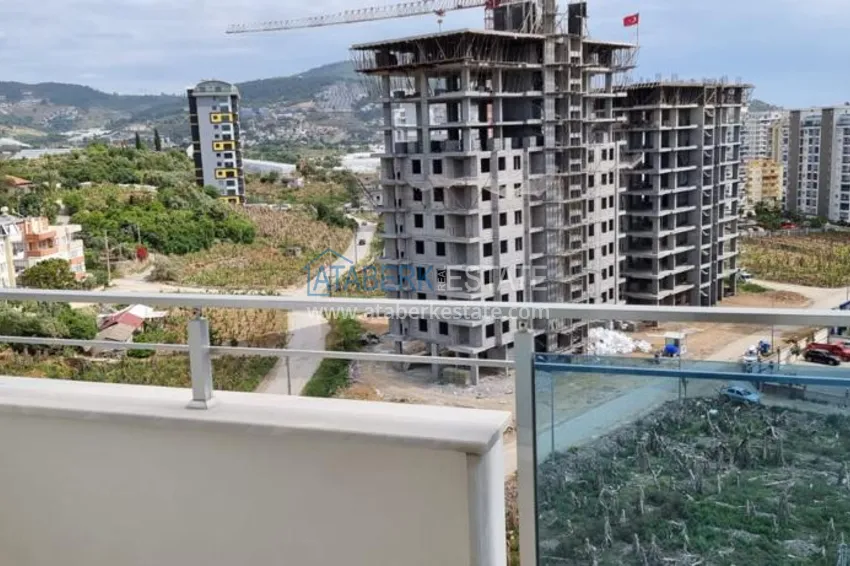 Приобрести Квартира в Махмутларе в благоустроенном жилом комплексе полностью готовая для проживанияи с мебелью с видом на море и горы 12 