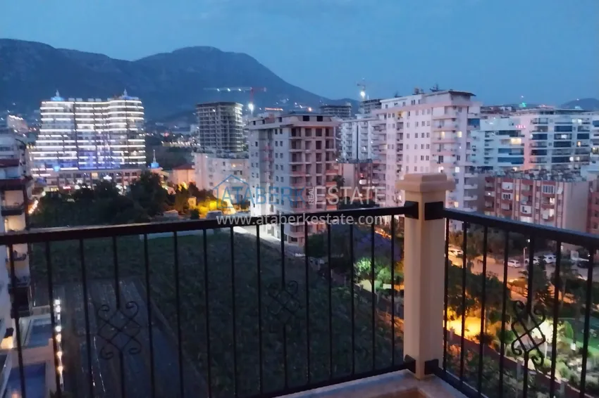 Приобрести Квартира в Махмутларе меблированная с видом на море и горы c великолепным месторасположением - в 50 метрах от центральной улицы района 13 