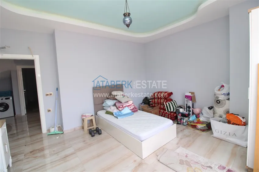 Приобрести Пентхаус в Махмутларе с мебелью, сауной и видом на море и горы 12