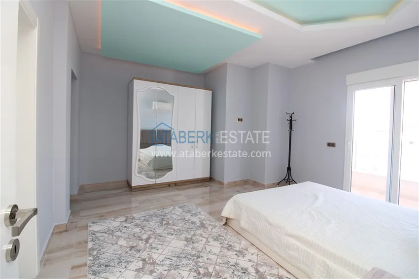 Приобрести Пентхаус в Махмутларе с мебелью, сауной и видом на море и горы 13