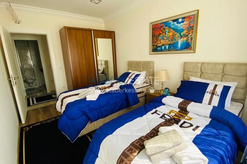 Приобрести Квартира в Махмутларе меблированная с отдельной кухней и видом на горы располагает собственной охраняемой территорией с инфраструктурой 16 