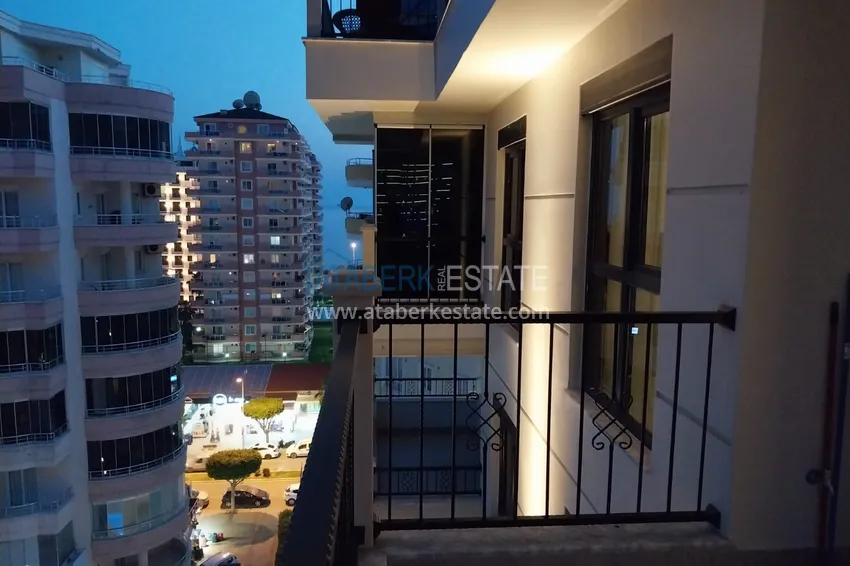 Приобрести Квартира в Махмутларе меблированная с видом на море и горы c великолепным месторасположением - в 50 метрах от центральной улицы района 15 