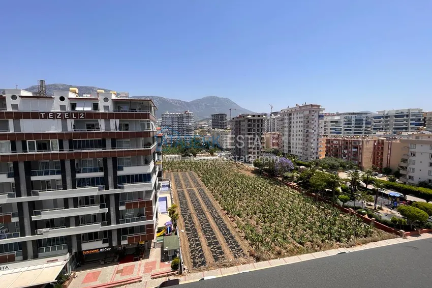 Приобрести Квартира в Махмутларе с видом на горы в современном жилом комплексе 15 