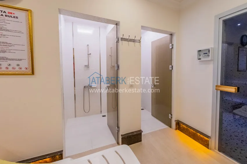 Квартира в Махмутларе меблированная с отдельной кухней и видом на горы располагает собственной охраняемой территорией с инфраструктурой 23 