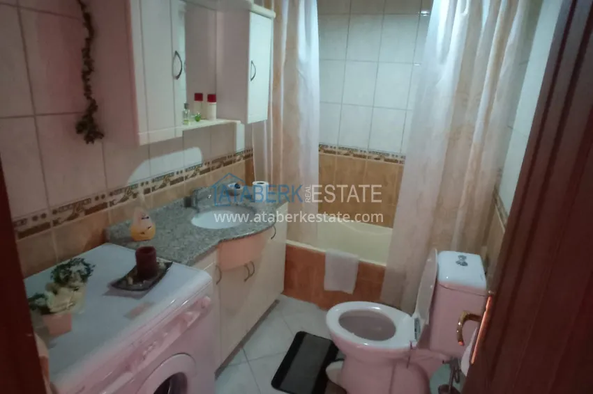 Приобрести Квартира в центре Алании четырехкомнатная с мебелью и отдельной кухней 19 