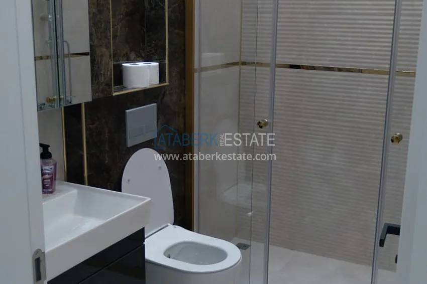 Приобрести Квартира в Махмутларе двухкомнатная с мебелью в комплексе премиум-класса 19